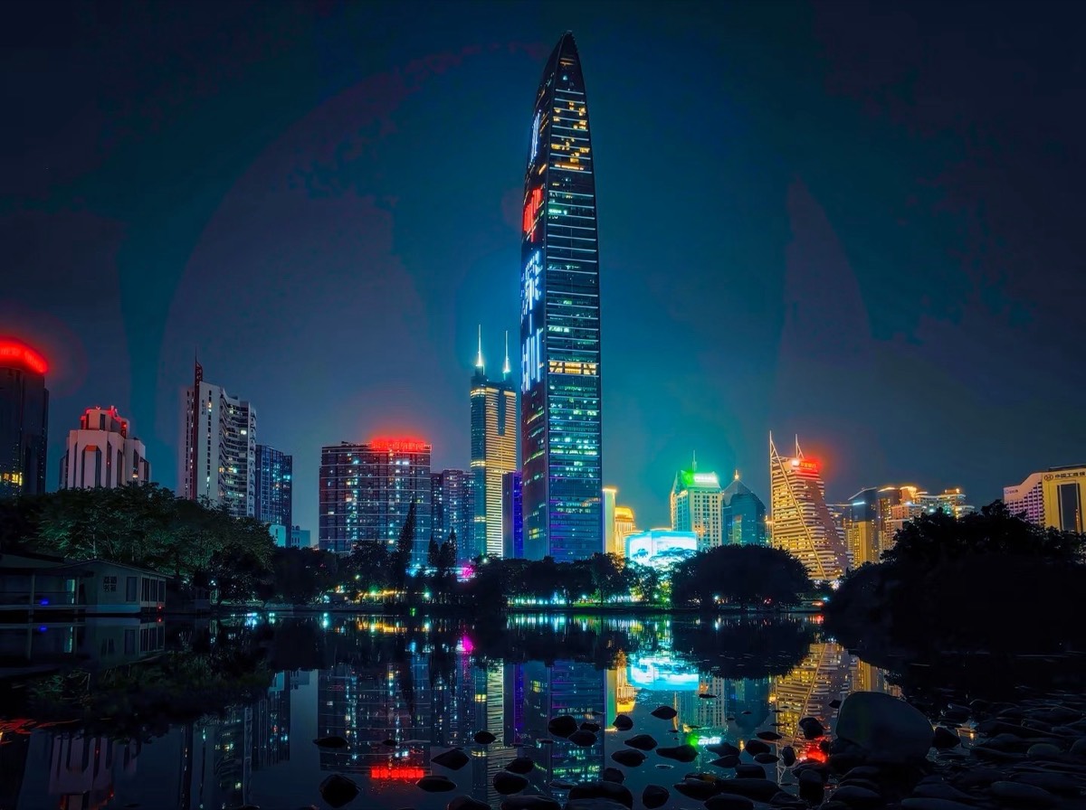 Wide night view of the Luohu skyline and the Lizhi Park lake reflection